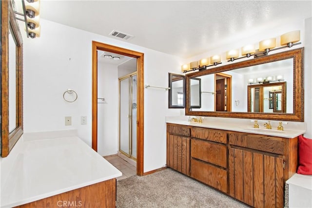 bathroom with an enclosed shower and vanity