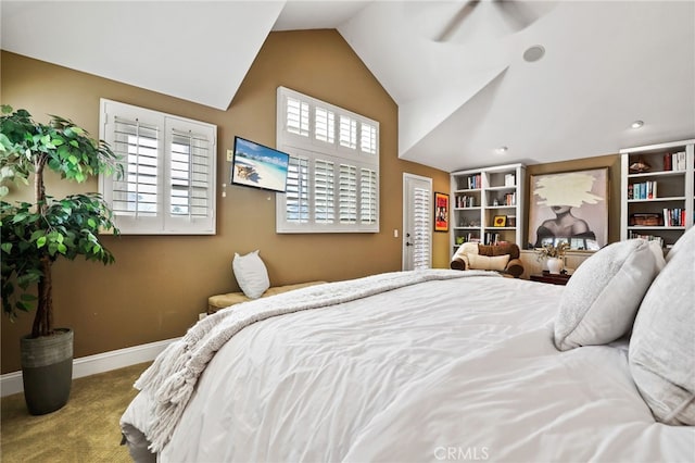 carpeted bedroom with vaulted ceiling