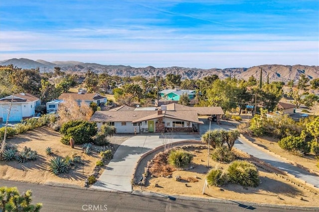 drone / aerial view featuring a mountain view