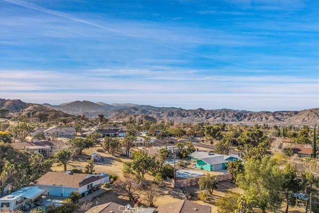 birds eye view of property with a mountain view