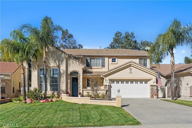 view of front of home featuring a front yard and a garage