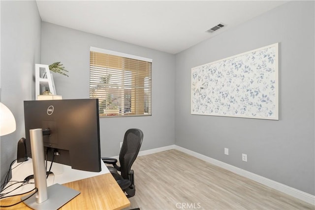 office space with hardwood / wood-style floors