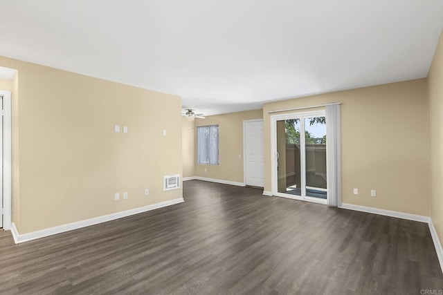 unfurnished living room with dark wood-type flooring and ceiling fan