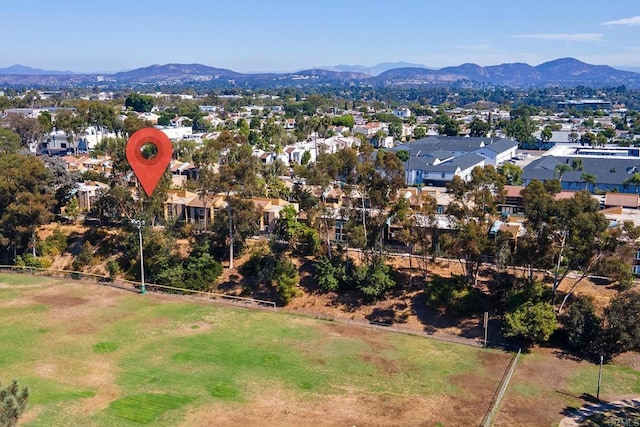 birds eye view of property featuring a mountain view