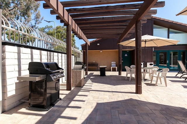 view of patio / terrace with a grill and a pergola