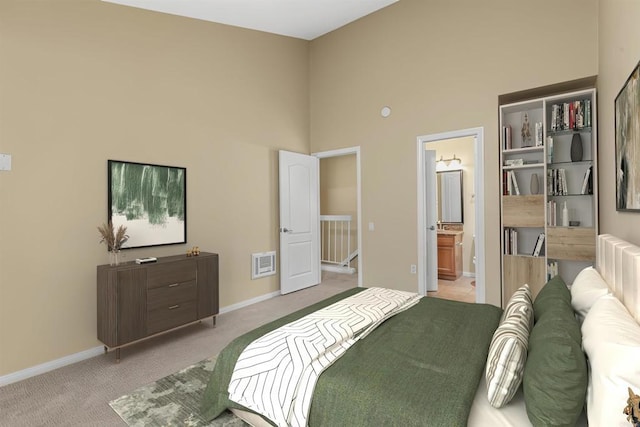 carpeted bedroom featuring ensuite bathroom and a high ceiling