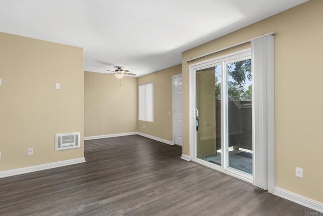 empty room featuring dark wood-type flooring and ceiling fan