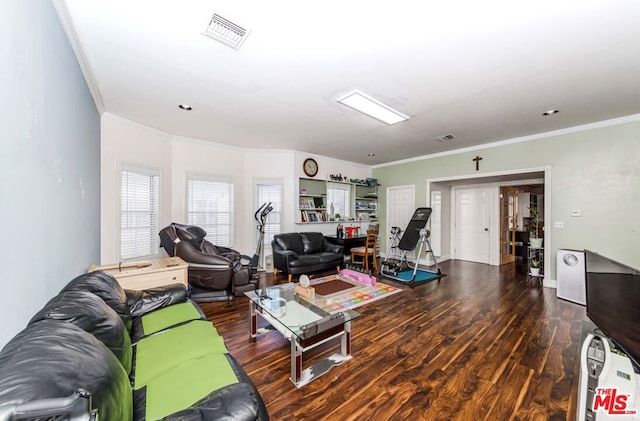 living room featuring dark hardwood / wood-style floors and ornamental molding