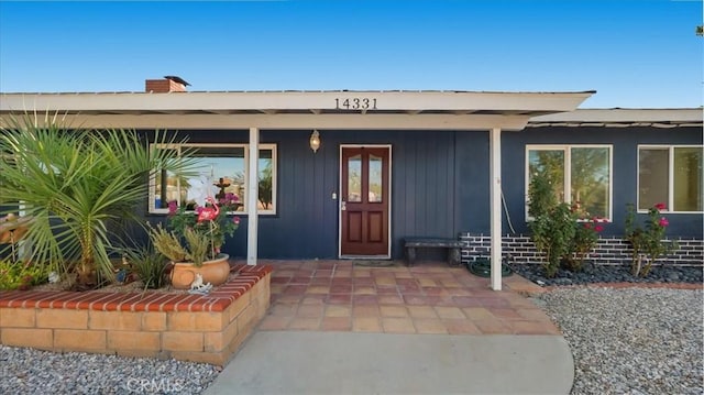 entrance to property with covered porch