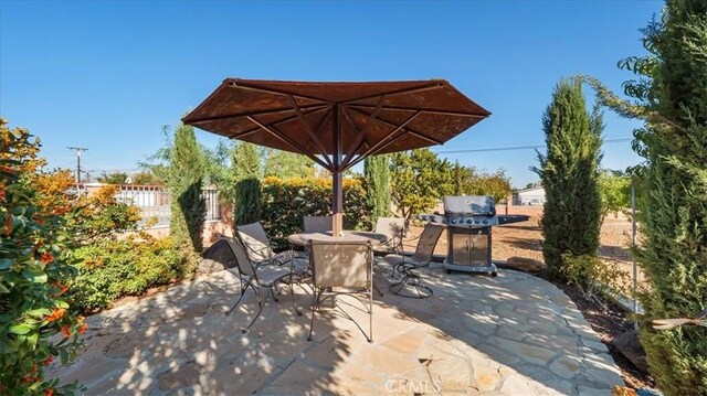 view of patio featuring a grill