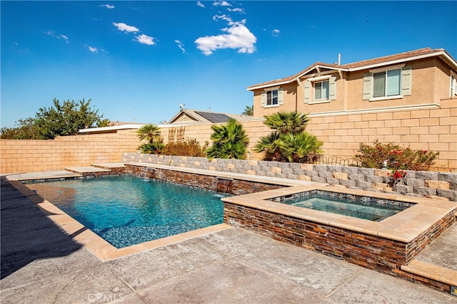 view of pool with an in ground hot tub and pool water feature