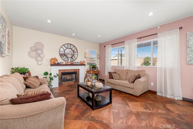 living room with a tile fireplace