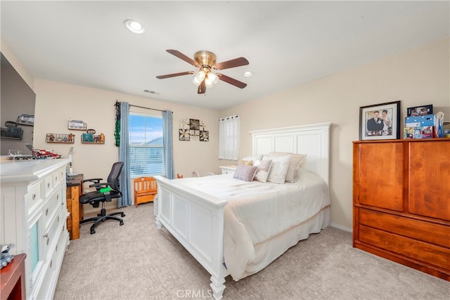 bedroom with light carpet and ceiling fan