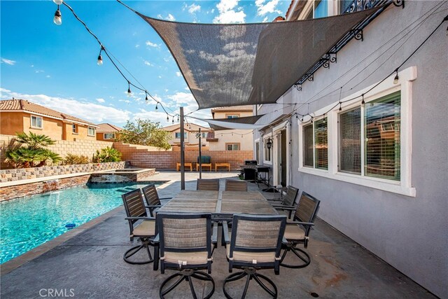 view of patio with a fenced in pool and area for grilling