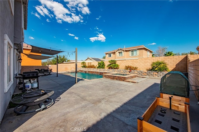 view of pool featuring area for grilling and a patio