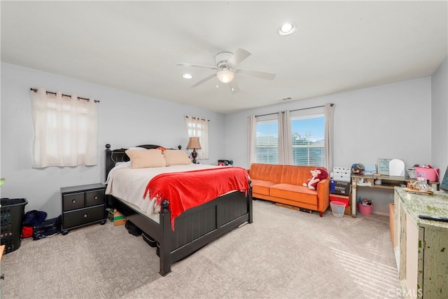 carpeted bedroom with ceiling fan