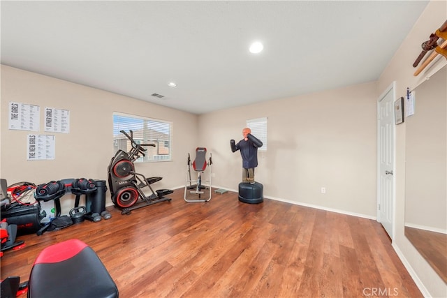 exercise area with wood-type flooring