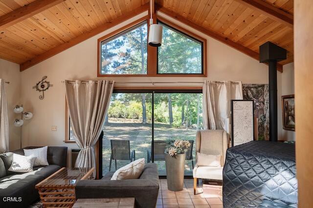 tiled living room with beam ceiling, wood ceiling, and high vaulted ceiling