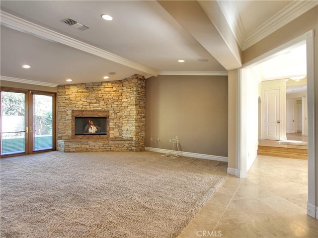 unfurnished living room with a stone fireplace, ornamental molding, and light tile patterned floors