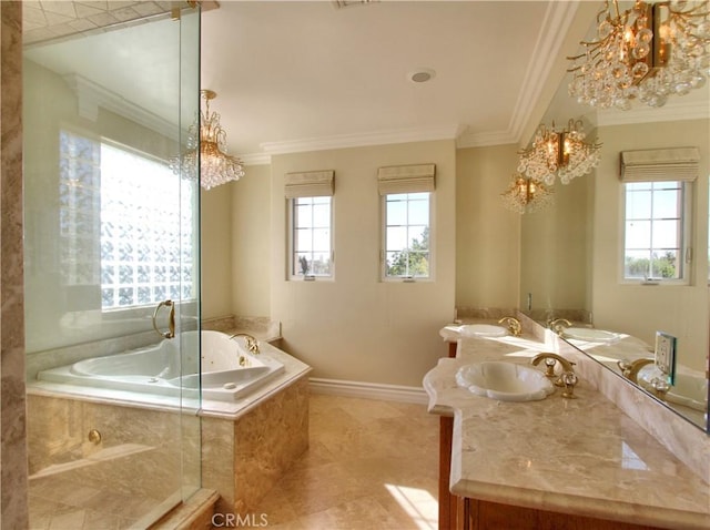 bathroom featuring tiled tub, a wealth of natural light, and a notable chandelier