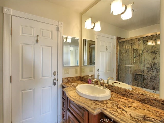 bathroom featuring vanity and walk in shower