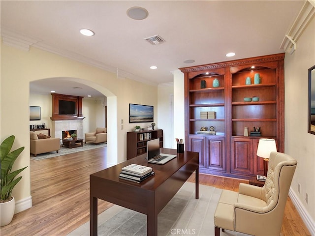 office featuring light hardwood / wood-style flooring and ornamental molding