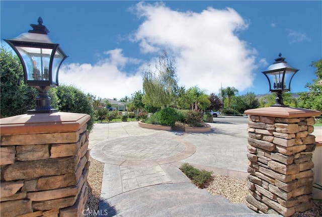 view of property's community with a patio area