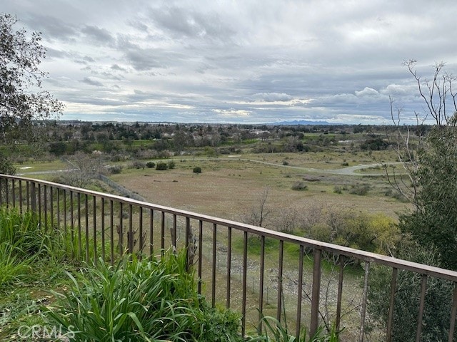 balcony featuring a rural view