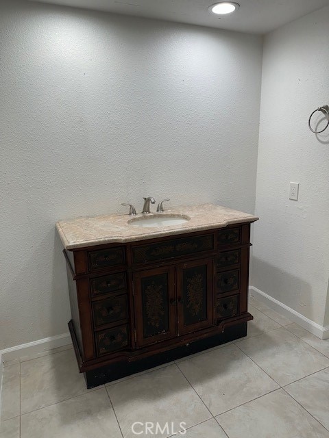 bathroom featuring vanity and tile patterned flooring