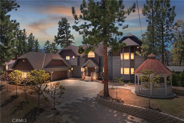 view of front of property with a garage and a gazebo