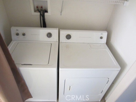 laundry area featuring washing machine and clothes dryer