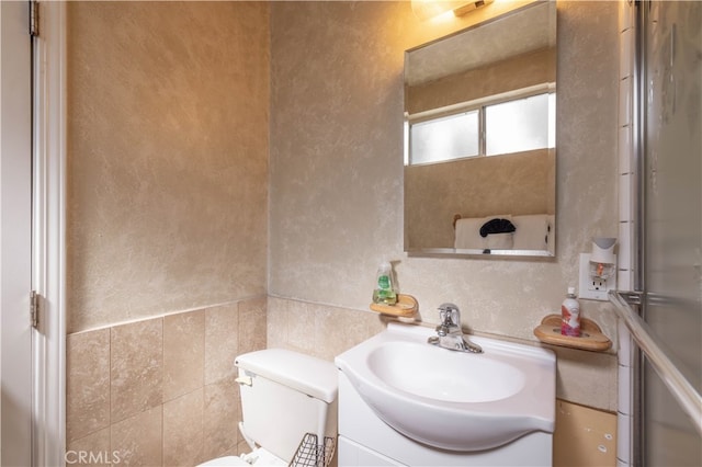 bathroom with toilet and vanity