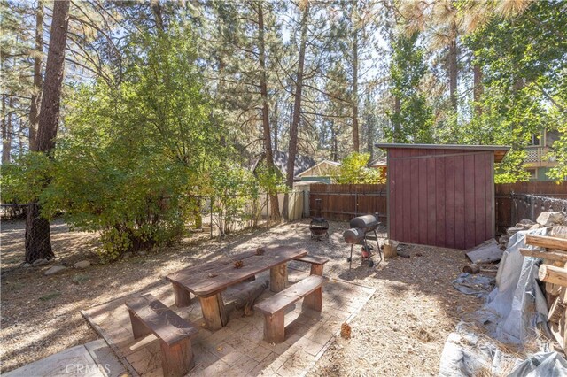 view of patio / terrace featuring a storage shed