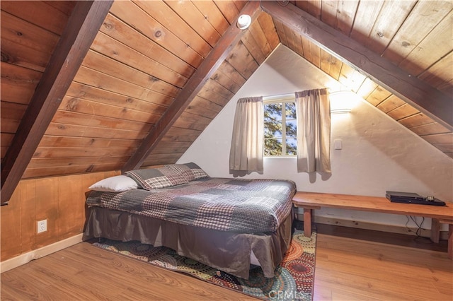 bedroom with light hardwood / wood-style flooring, lofted ceiling, and wooden ceiling