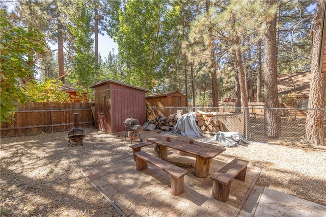 view of patio with a storage shed