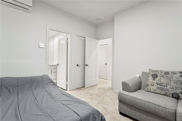 bedroom featuring a wall mounted AC and light colored carpet