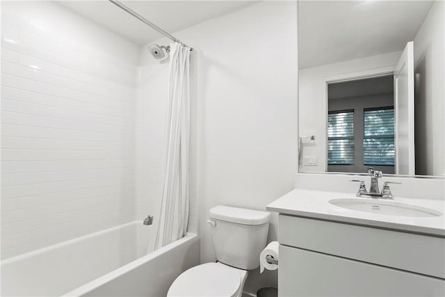 full bathroom with vanity, shower / bath combo, and toilet