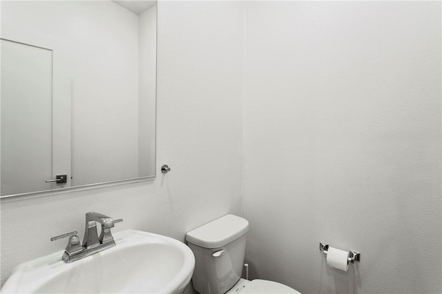 bathroom with sink and toilet