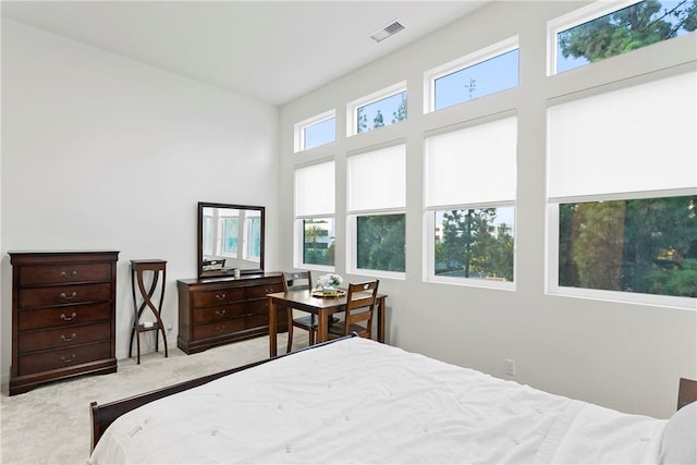 bedroom featuring light colored carpet