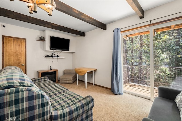 carpeted bedroom with ceiling fan, access to exterior, and beam ceiling