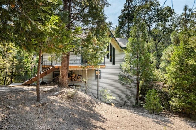 back of property with stairs
