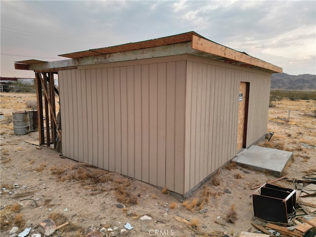 view of outbuilding featuring a mountain view