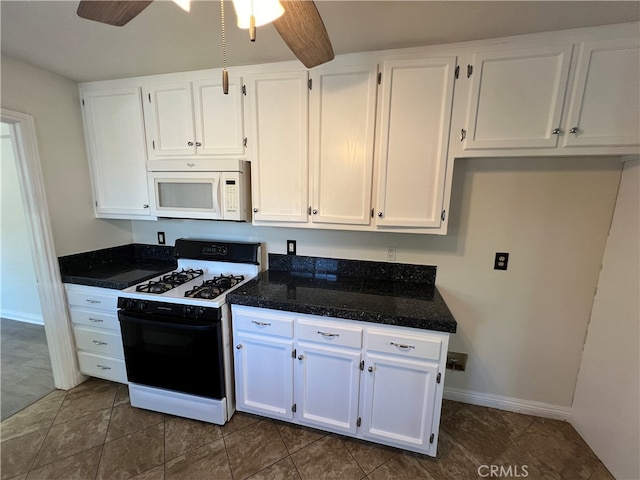 kitchen featuring white appliances, ceiling fan, and white cabinetry