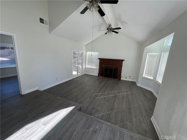 unfurnished living room featuring high vaulted ceiling, dark wood-type flooring, and ceiling fan