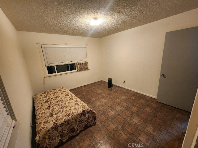 interior space featuring a textured ceiling