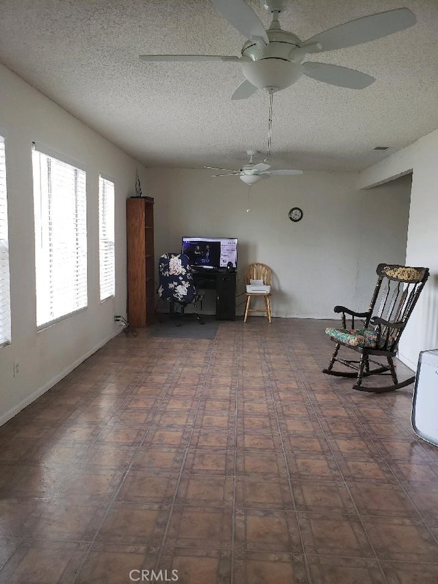 unfurnished room with a textured ceiling