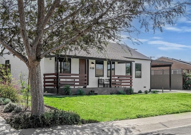 view of front of home featuring a porch, a front yard, roof with shingles, stucco siding, and a carport