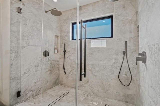 bathroom with a shower stall