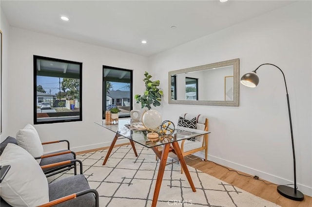 dining space with recessed lighting, baseboards, and light wood finished floors