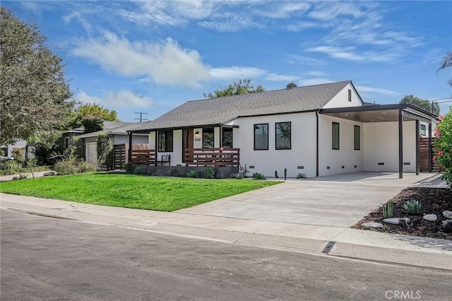 ranch-style home with stucco siding, driveway, a front lawn, a porch, and a carport